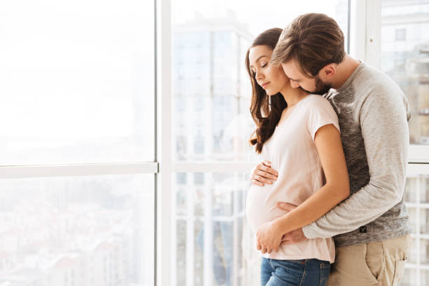 istock Lovely pregnant young couple 1269311505