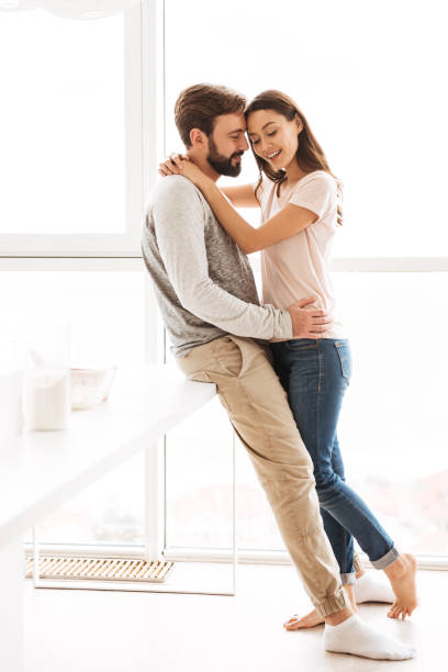 istock Happy young couple embracing 1269313198