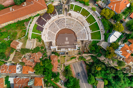 Aerial drone shot of  Ancient Roman theatre, Plovdiv, Bulgaria - (Bulgarian: Римски античен театър Пловдив, България). Plovdiv Roman theatre is one of the world's best-preserved ancient Roman theatre, located in the city center of Plovdiv, Bulgaria. It was constructed in the 90s of the 1st century AD, probably during the reign of Emperor Domitian. The theatre can host between 5000 and 7000 spectators and it is currently in use. The picture is taken with DJI Phantom 4 Pro drone / quadcopter.
