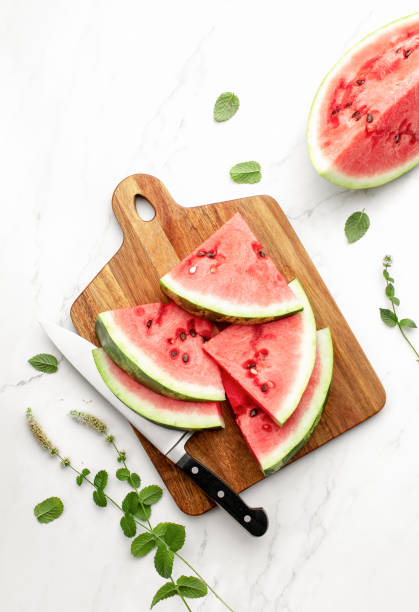 istock Watermelon slices lying on a cutting board 1269318452