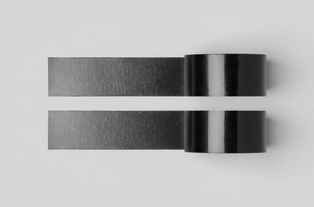 istock Two black unrolled duct tapes mockup on a grey background. 1269321190