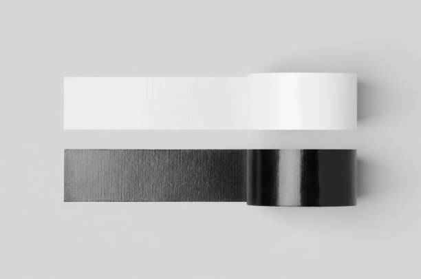 istock White and black unrolled duct tapes mockup on a grey background. 1269321458