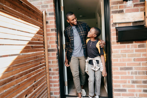 istock Returning to school. Dad and son leaving the house 1269322968