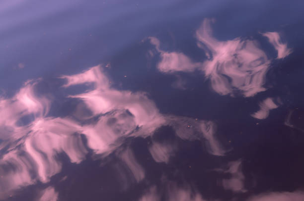 istock abstract background with pink clouds reflected in the water 1269323866