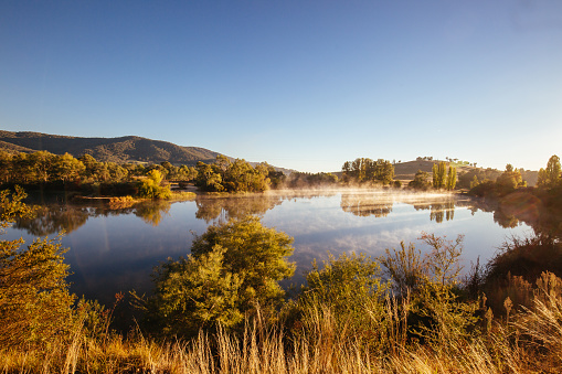 Classic Australian landscape and misty lake on a cold morning in Allans Flat, near Yackandandah in Victoria Australia