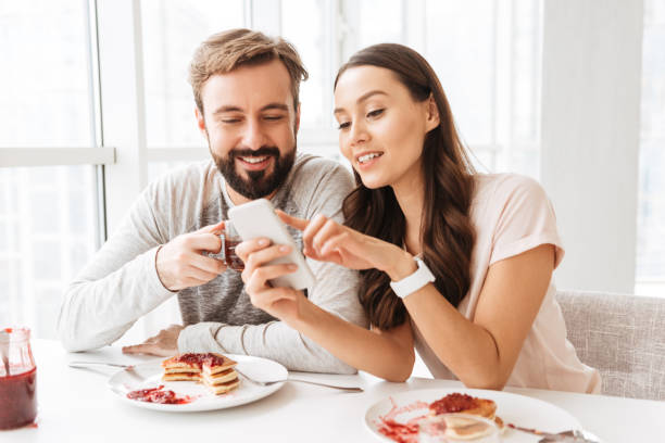 istock Beautiful young couple having breakfast 1269325326
