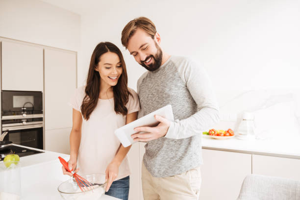 istock Joyful young couple cooking pastry 1269326815
