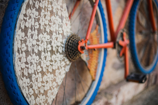 close-up detail of retro motorcycle, chain, wheel, bronze motorcycle. vietnamese motorcycle. beautiful retro moped. High quality photo