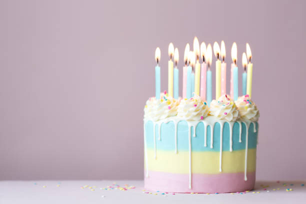 istock Pastel birthday cake with birthday candles 1269328553