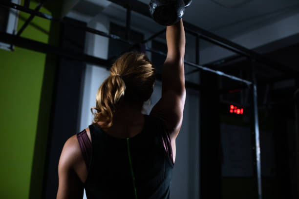 istock A strong blonde woman lifting a kettlebell 1269330727