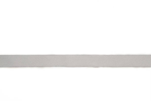 istock Shiny silver satin ribbon on white background 1269332662