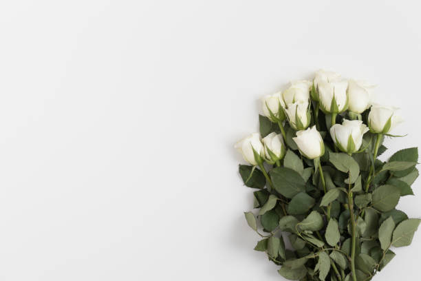 istock Bouquet of roses on a white table. Flat lay with blank copy space. 1269335871