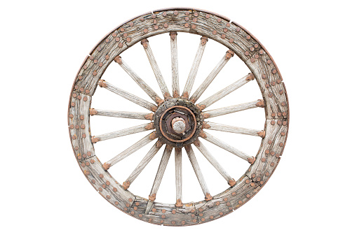 Old wooden wagon wheel isolated on white background