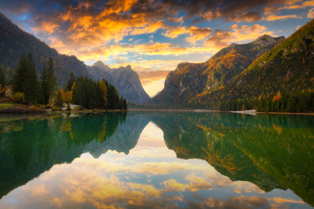 istock Dolomites mountains with reflection in Lago di Dobbiaca lake 1269356523