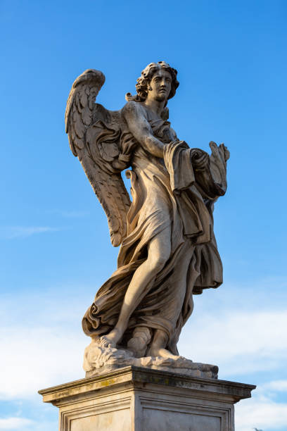 istock Angel statue on the Saint Angelo Bridge over Tiber river in Rome 1269357944
