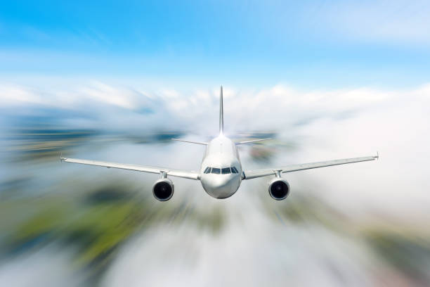 istock Passenger Airliner flying in the clouds high speed. 1269361082