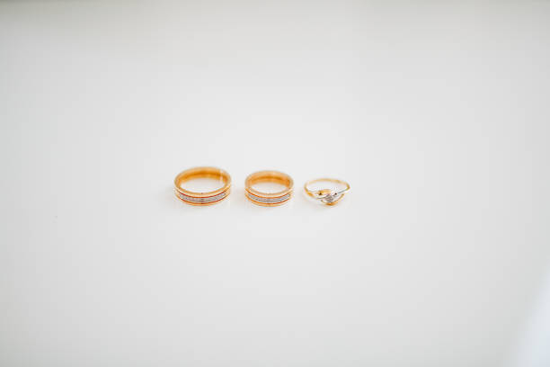 Oval diamond engagement ring with wedding ring bands for bride and groom