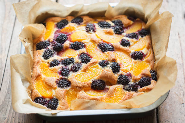 Cake with blackberries and peaches