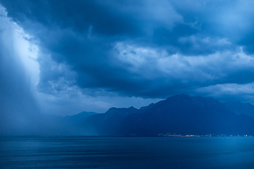 Dramatic sky above Lac Leman Lake Geneva at night