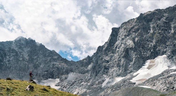 istock Young man at rocky mountains background 1269363630