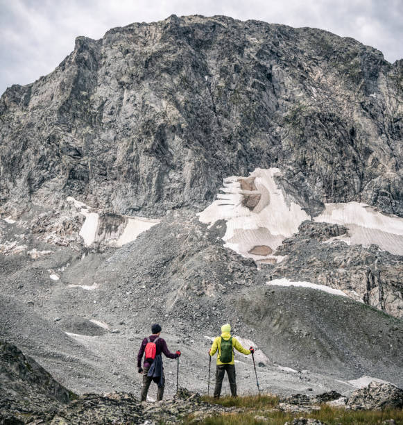 istock Two men at rocky mountains background 1269363788