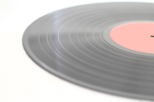 istock 12-inch LP vinyl record disk with blank red label. Close-up shot, top view 1269366977