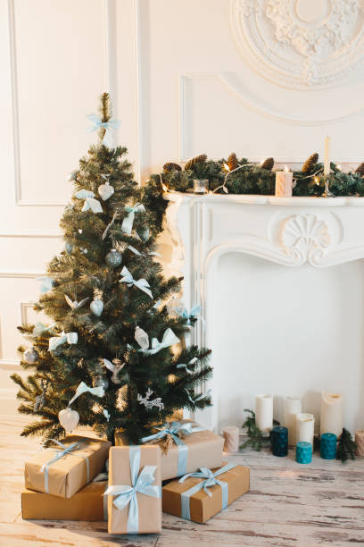 istock Decorated Christmas tree and boxes with gifts underneath. 1269368675