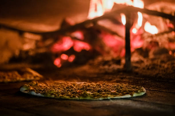 istock Cooking lahmacun ( Turkish pita ) in the stone oven 1269371015