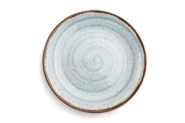 istock Empty blue ceramic plate isolated on white background. Top view, flat lay, close up. 1269374592