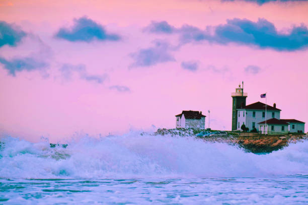 Pink Waves Watch Hill Light at sunset on a windy Rhode Island day westerly rhode island stock pictures, royalty-free photos & images