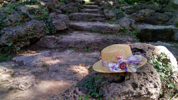 istock A beautiful women`s straw hat on the stone 1269375654