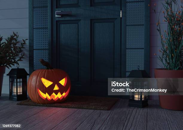 Jack O Lantern In Front Of Door Stock Photo - Download Image Now - Halloween, Spooky, Jack O' Lantern
