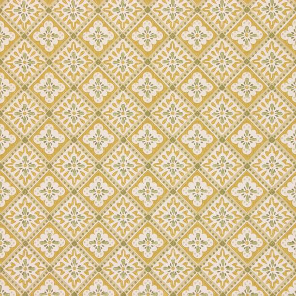 istock Vintage wallpaper texture with a yellow and green diamond shaped floral pattern 1269378569