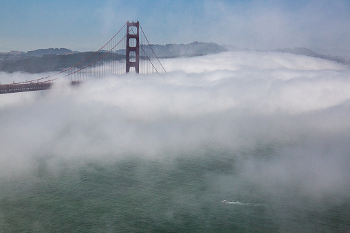 Golden Gate Bridge in fog in San Francisco, CA, United States