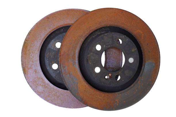 istock Old rusty brake disc from car isolated on white background 1269380106