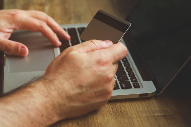 istock Hand holding credit card 1269381139