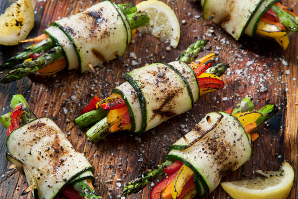 BBQ Zucchini Rolls BBQ Zucchini Rolls  with Asparagus, Carrots, Peppers and Seasoned with Salt and Pepper appetizer plate stock pictures, royalty-free photos & images