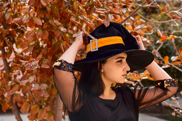 istock Woman in a witch costume 1269387009