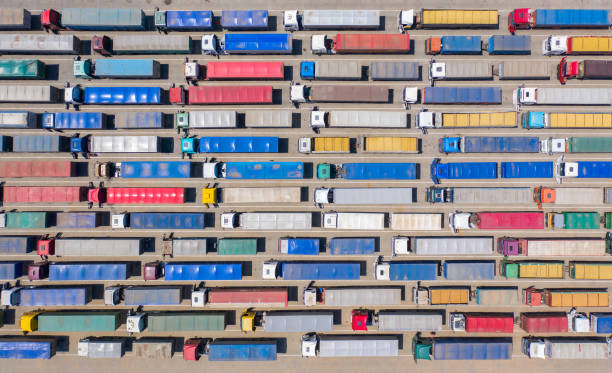 istock Trucks stand in line to the terminal. 1269388358