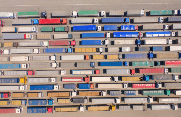 istock Trucks stand in line to the terminal. 1269388360