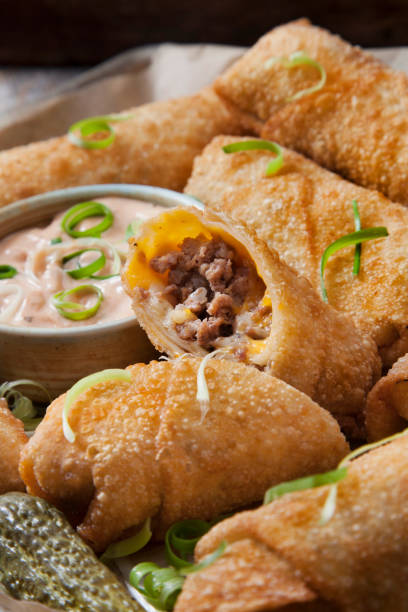 istock Cheeseburger Egg Rolls with Ketchup and a Spicy Mayo Dipping Sauce 1269391669