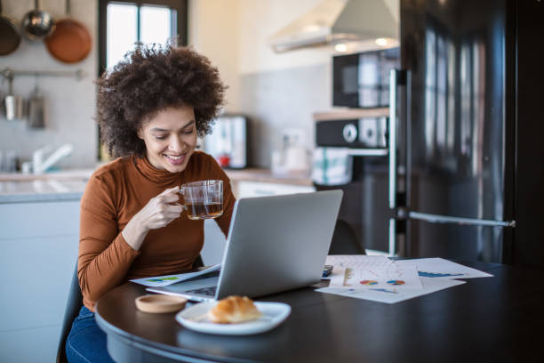 istock Beautiful young woman working from home 1269392592