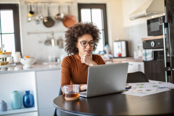 istock Beautiful young woman working from home 1269392917