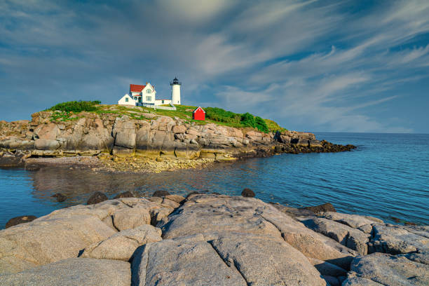 Cape Neddick, Maine, USA 8/02/2019. Nubble Light House at Nubble Point during low tide.