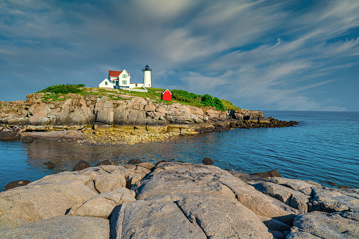Cape Neddick, Maine, USA 8/02/2019. Nubble Light House at Nubble Point during low tide.