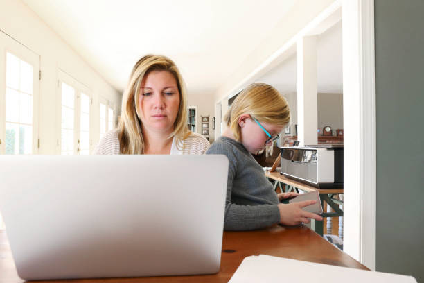 istock Woman Working From Home With Her Child Next To her 1269395416