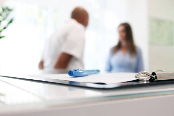 istock patient in a clinic talking to a doctor 1269396482