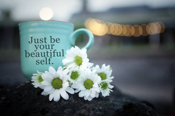 istock Text message on a coffee cup with daisy flowers decoration. Just be your beautiful self. 1269398422