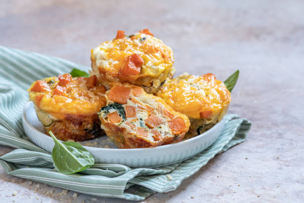 istock Delicious egg muffins with sweet potato and spinach 1269398976