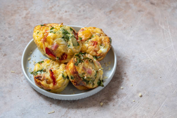 istock Delicious egg muffins with ham, cheese and vegetables 1269399549